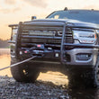 WARN ZEON XD 10-S 10,000 lb truck, Jeep, and SUV winch shown on an off-road vehicle near a river