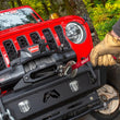 WARN ZEON XD 10-S 10,000 lb truck, Jeep, and SUV winch shown on a wooded trail