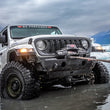 WARN ZEON XP 12-S 12,000 lb truck, Jeep, and SUV winch shown in snowy off-road conditions