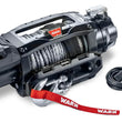 Angled view of the WARN ZEON XC 12-S 12,000 lb truck, Jeep, and SUV winch with 80 ft synthetic rope and hawse fairlead